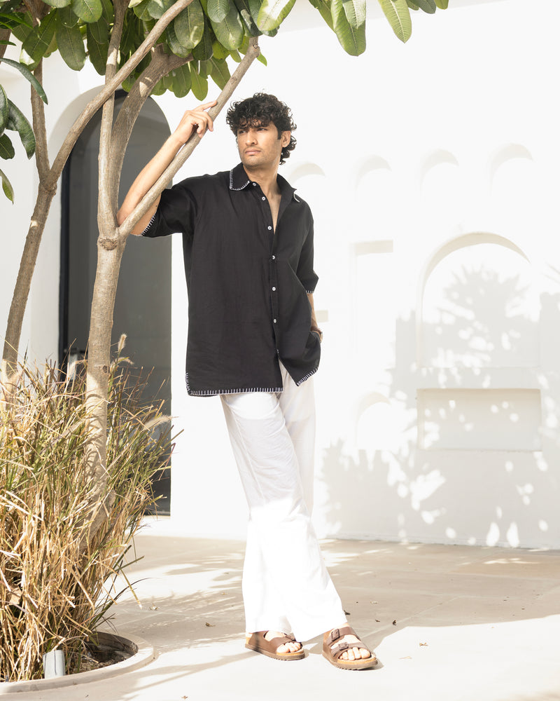 Minimal black cotton shirt for men featuring back embroidery and relaxed silhouette