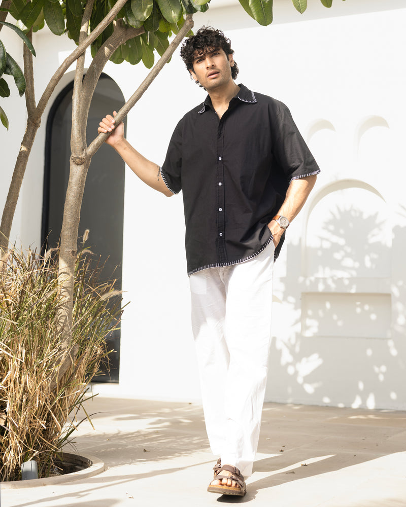 Men’s casual black shirt with Cuban collar and white stitch accents in soft cotton slub fabric