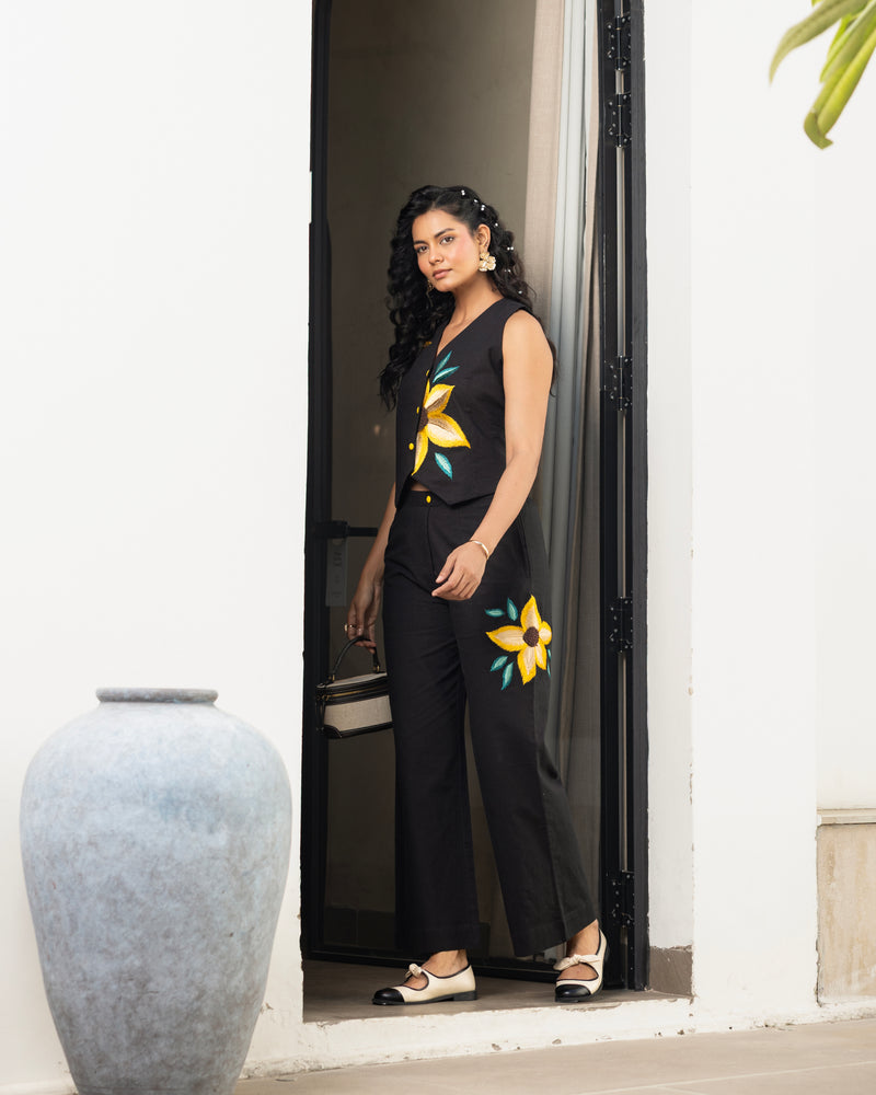 Women’s contemporary black outfit with floral embroidered waistcoat and relaxed fit pants