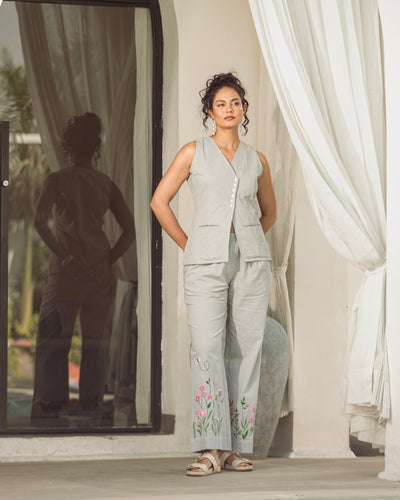 woman wearing grey cotton flex embroidered co ord set with floral hem detailing tailored fit summer outfit