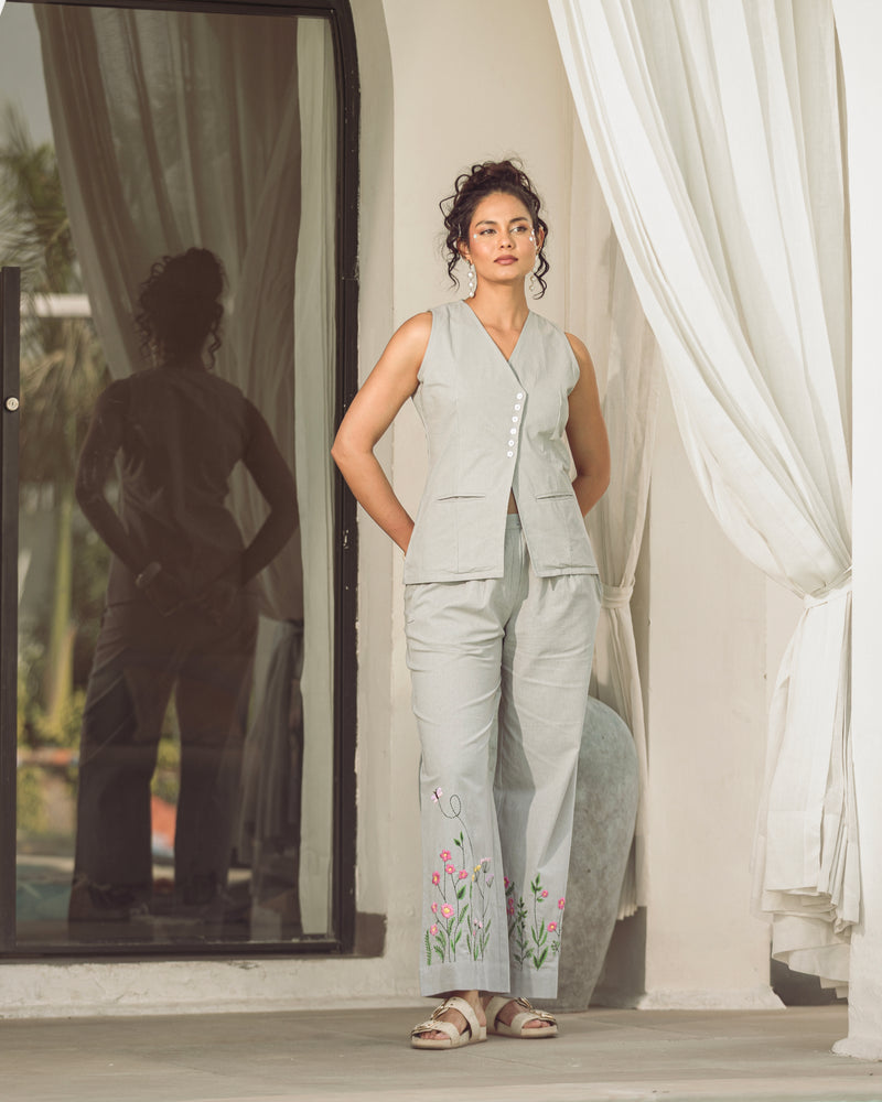 woman wearing grey cotton flex embroidered co ord set with floral hem detailing tailored fit summer outfit