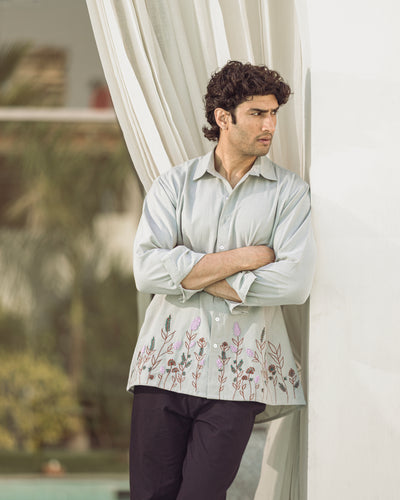 model wearing grey relaxed fit natural flex embroidered shirt with floral hem embroidery